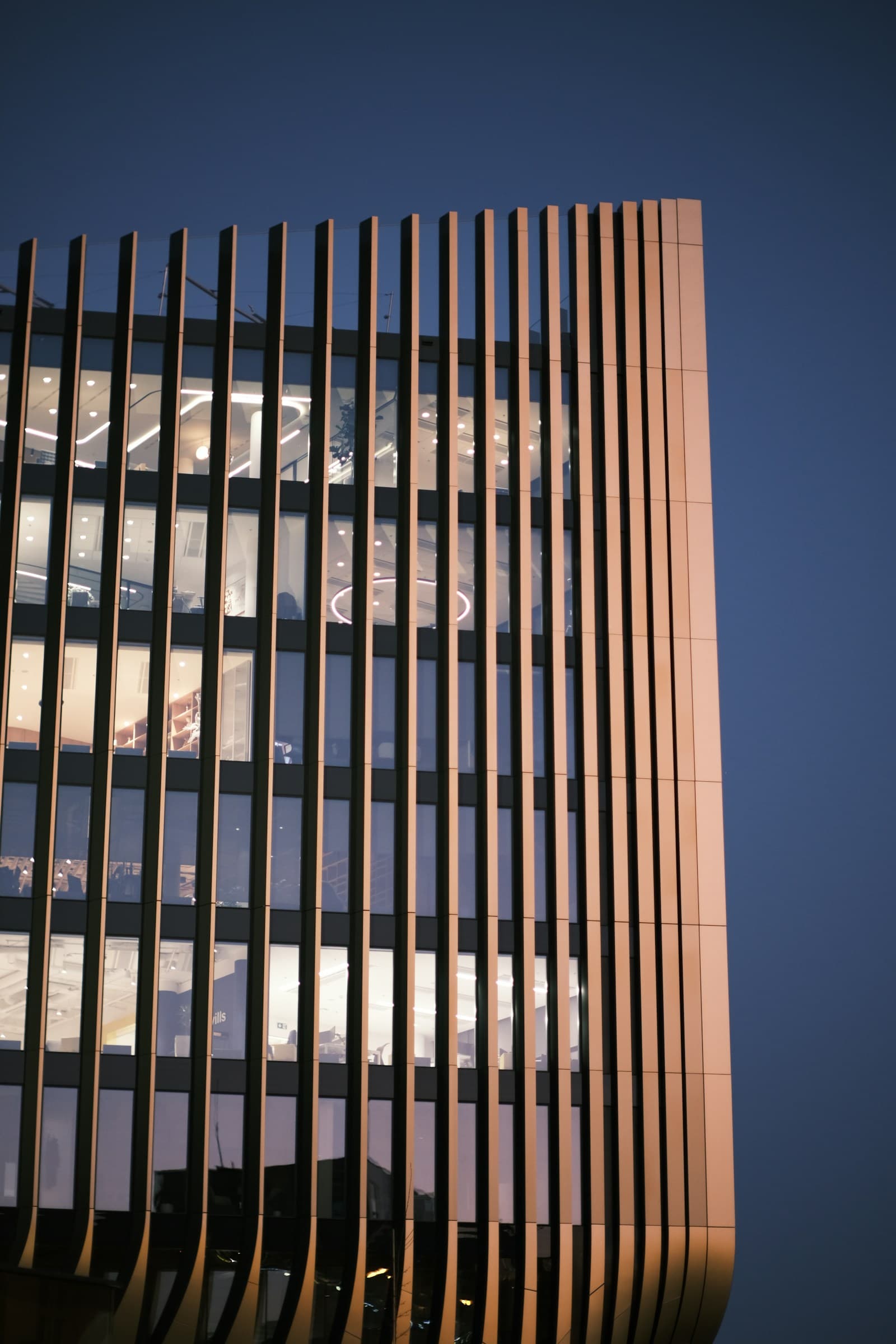 Building facade comparing a clean invisible grill against a traditional MS grill look