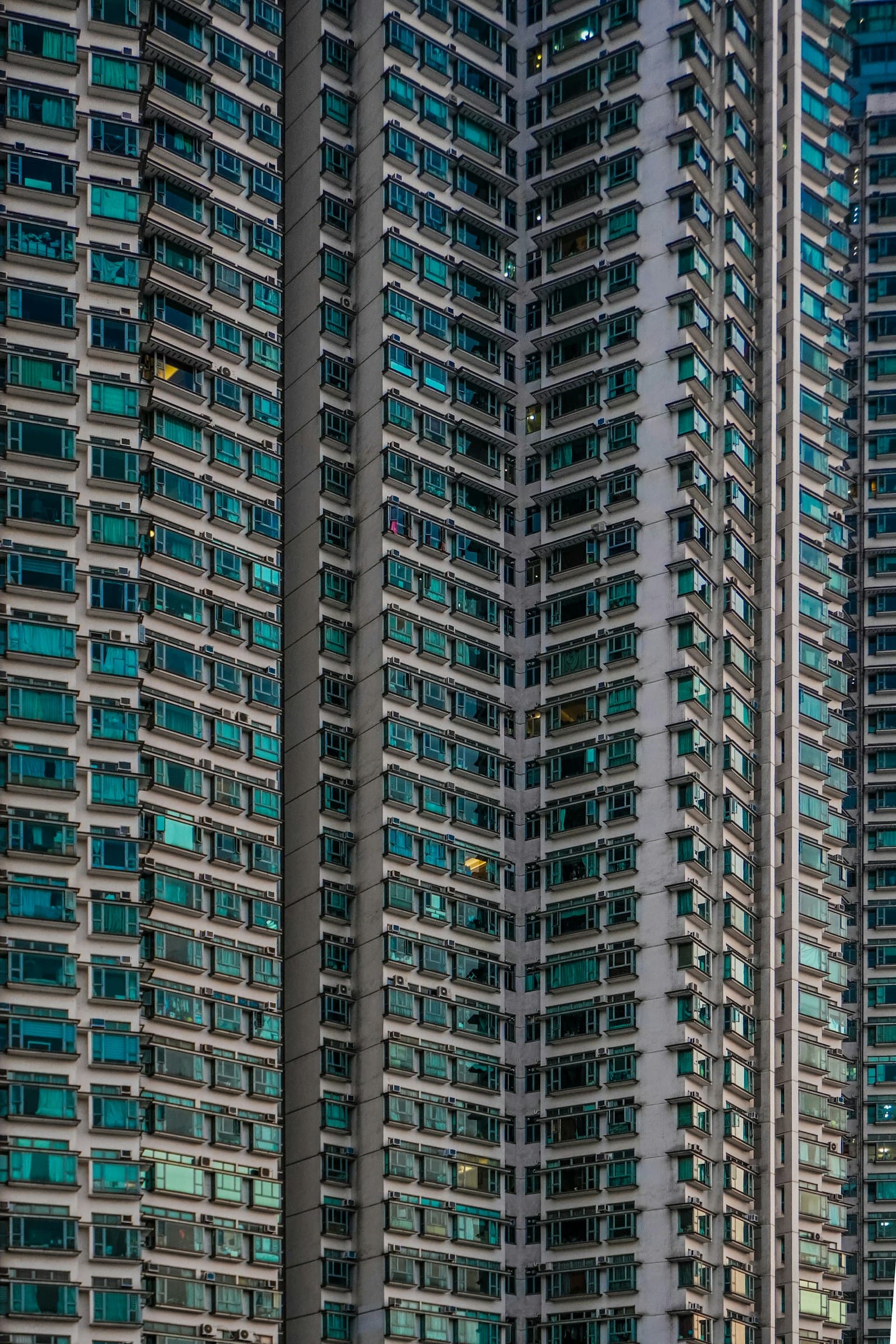 Nylon-coated SS316 invisible grill cables on a coastal apartment facade — the answer to does invisible grill rust starts inside the strand