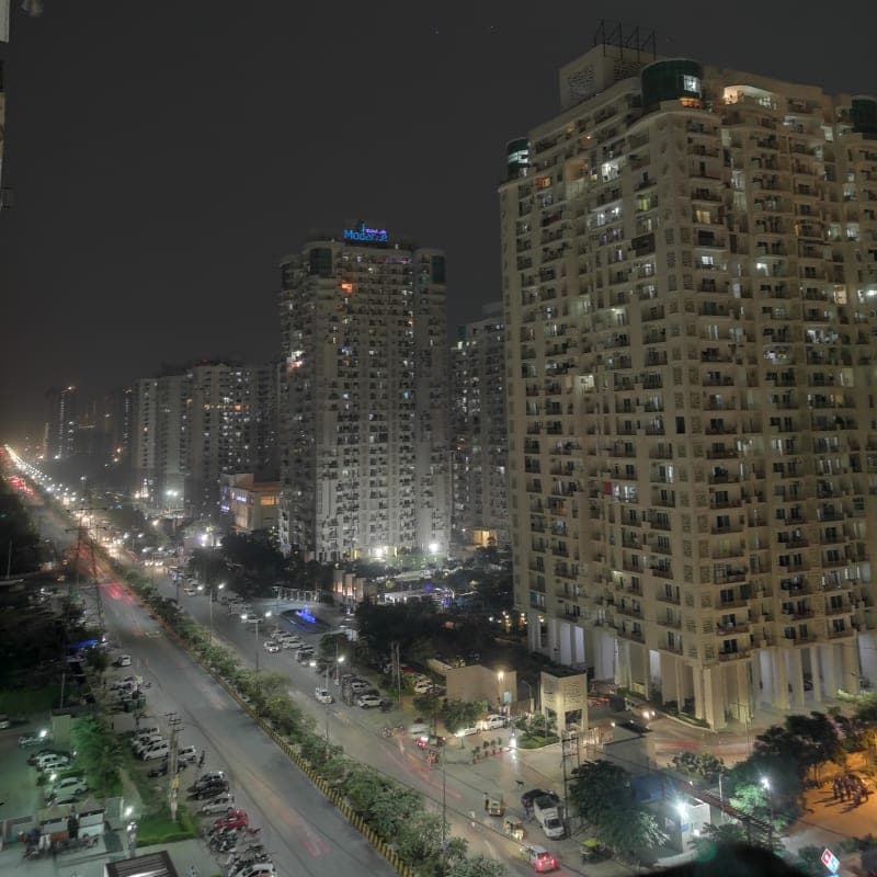 High-rise apartment towers in Sector 78, Noida at dusk
